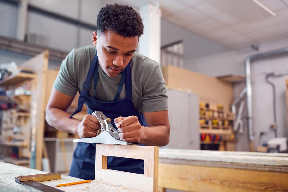 apprenticeship providers - Male Student Studying For Carpentry Apprenticeship